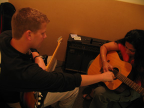 Instructor with guitar student at redondo locatrion