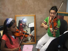 violin instructor and violin student